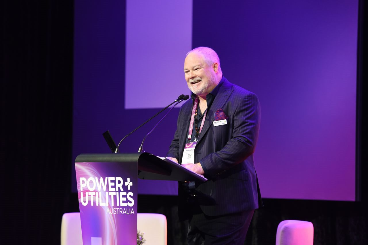Paul Mathers speaking at the lectern at Power + Utilities Australia